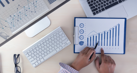 a website being analyzed on a tablet with bar chart visualization.