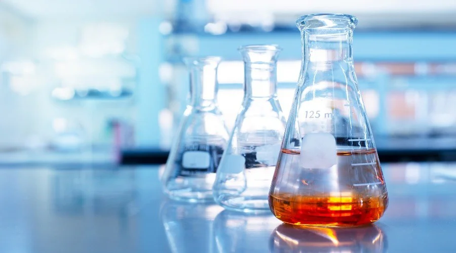 chemicals in beakers in a lab