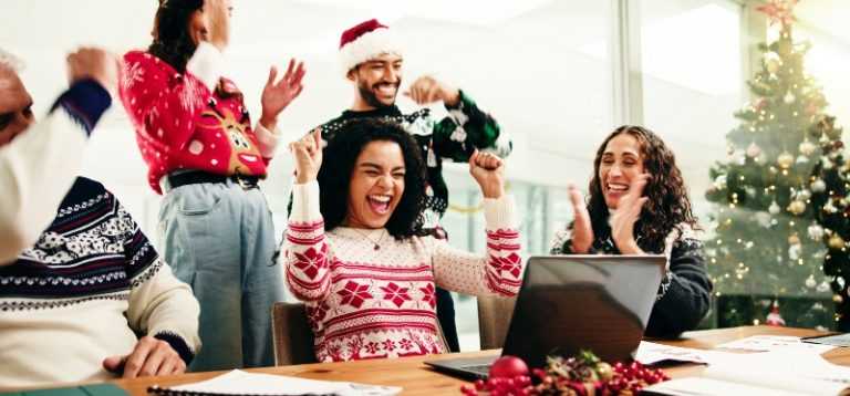work colleagues dressed in Christmas jumpers