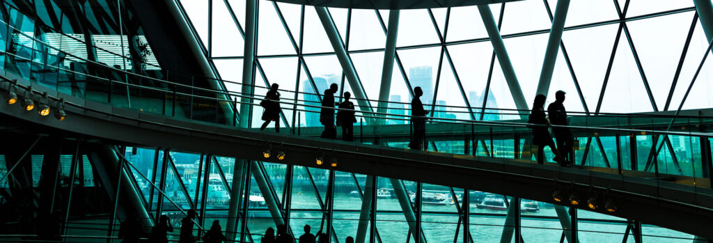 businesspeople walking in an office