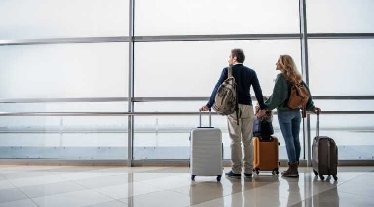 people with luggage at an airport