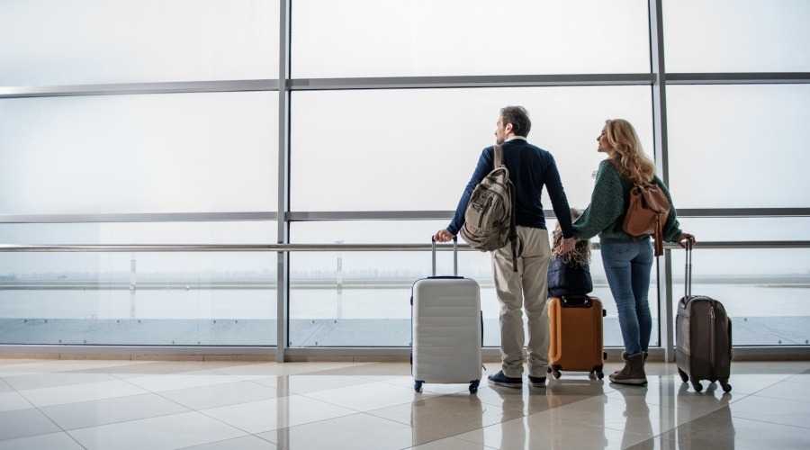 people with luggage at an airport