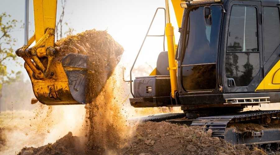 an excavator moving earth