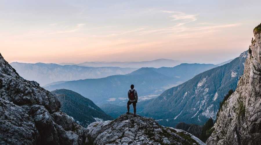 a hiker admiring the view from a mountain