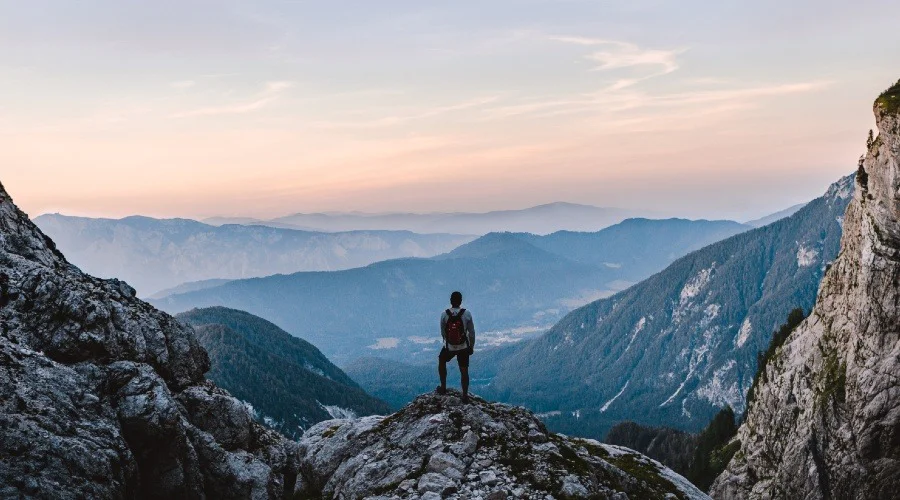 a hiker admiring the view from a mountain