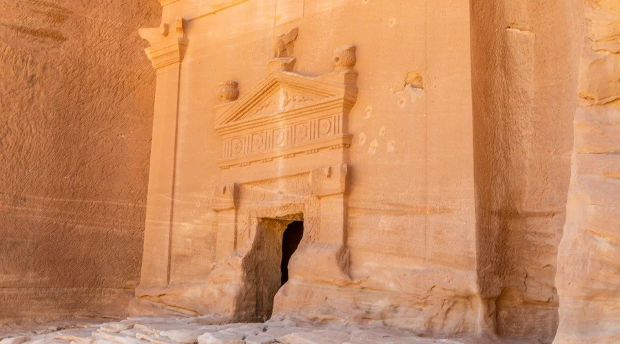 the ornate entrance of a tomb at Al-Ula