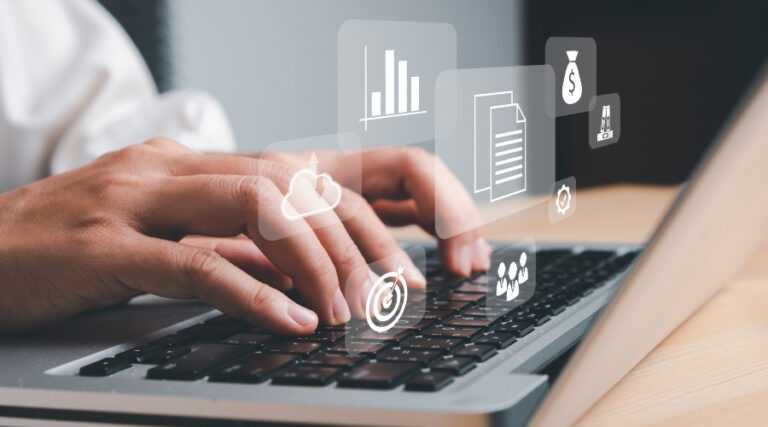 hands typing on a laptop