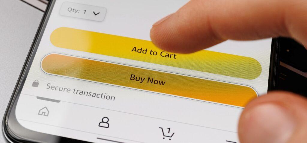 a finger hovering above the buy now button on an Amazon listing