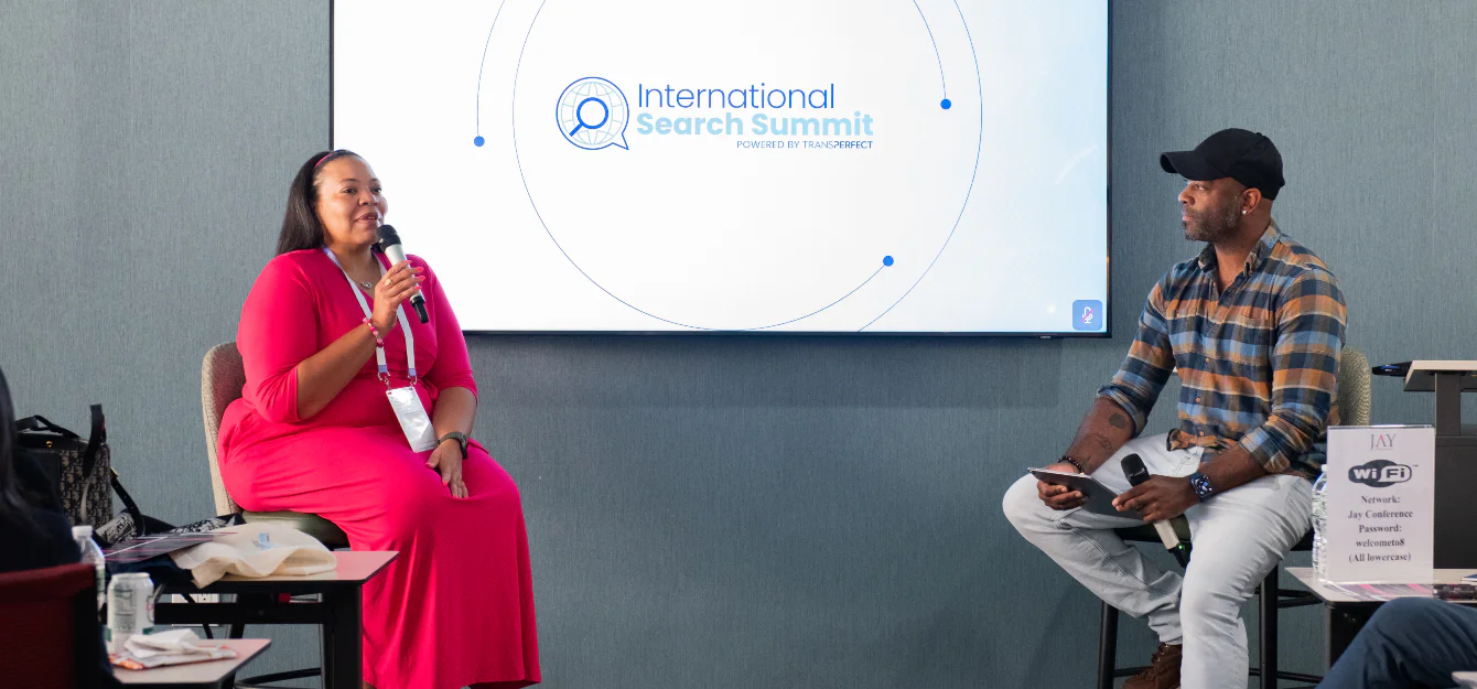 Jannelle McKnight and Kyrus Westcott speaking at the International Search Summit New York 2026